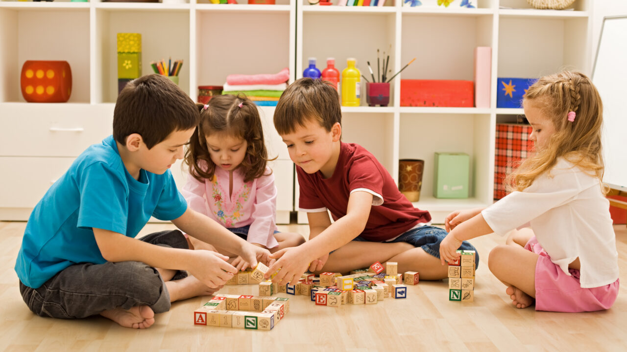 Children,Playing,With,Blocks,On,The,Floor,-,Focus,On